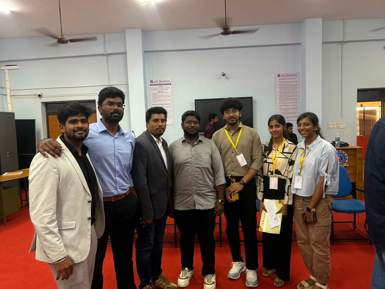 Midhun P M with the PRISM team at the AI Innovation Hackathon at ASIET
