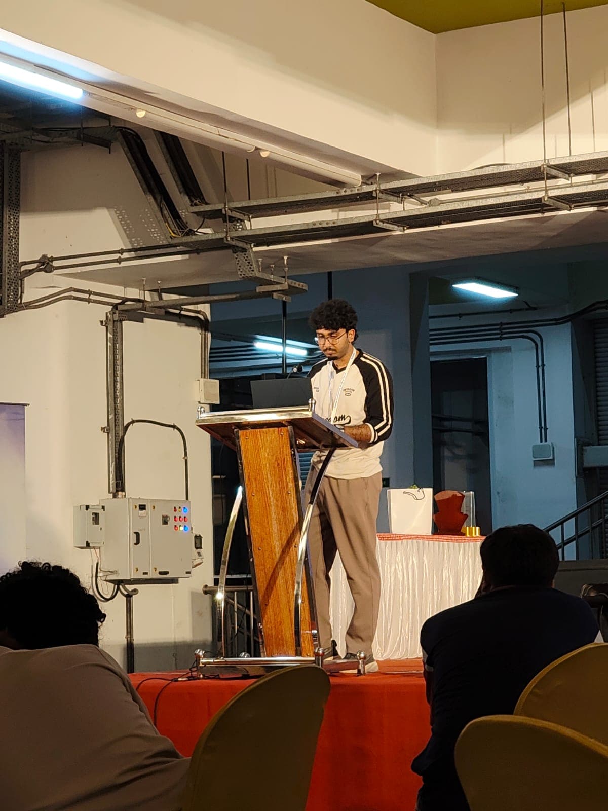 Midhun P M presenting at OpenAI Codex Nightline hackathon, Kochi, July 2026