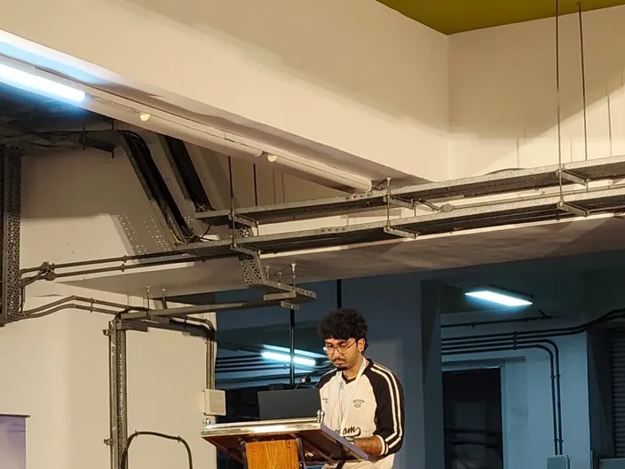Midhun P M presenting MetroMind at the OpenAI Codex Nightline Hackathon in Kochi
